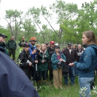 GBMP Coordinator Andrea Morehouse explains recent DNA results to local residents on a field tour. Credit: GBMP